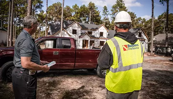 BFS Worker and Contractor in Front of Jobsite