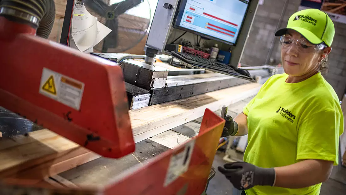 BFS employee working with boards and machinery