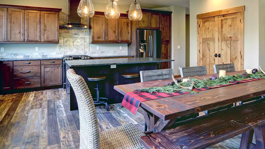 Kitchen featuring Reclaimed Wood Floors, Cabinets and Table