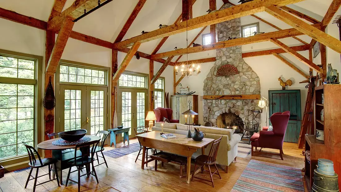 Living Area featuring Reclaimed Wood Floors and Beams, and Fireplace